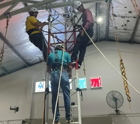 Trainees practising work-at-height procedures under supervision