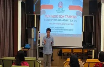HSR induction session with speaker and branded training slide